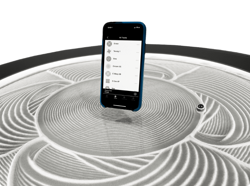 Sisyphus App on Metal Coffee Table iPhone with Sisyphus App Displayed on Metal Coffee Table
